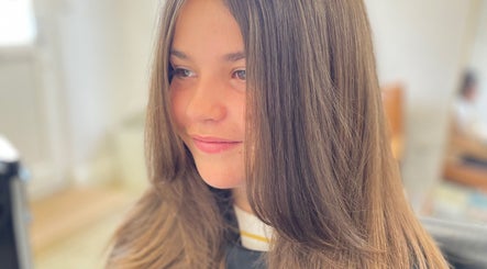 Young woman with shiny, sleek hair styled at The Hair Studio, Banbury, England, GB.