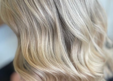 Blonde wavy hairstyle at The Hair Studio, Banbury, England, GB showcasing expert styling.