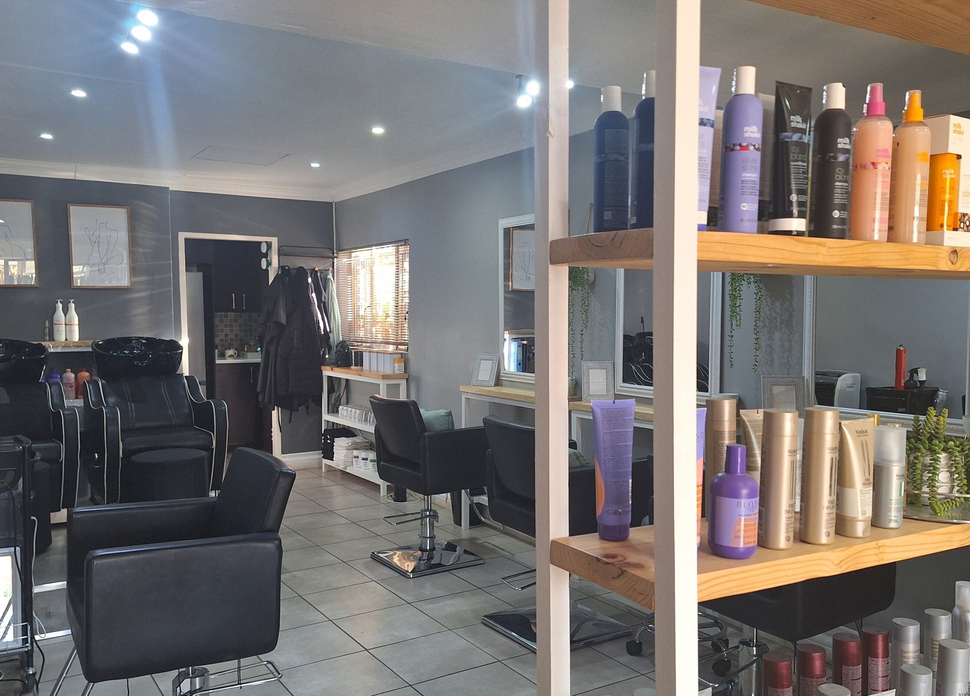 Interior of Refresh Skin Health Salon in Pretoria, Gauteng, ZA; showcasing sleek styling stations and a range of beauty products.