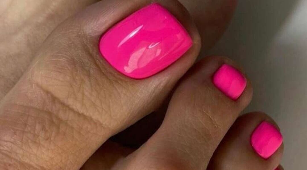 Bright pink pedicure at Refresh Skin Health Salon, Pretoria, Gauteng, ZA enhancing nail beauty.