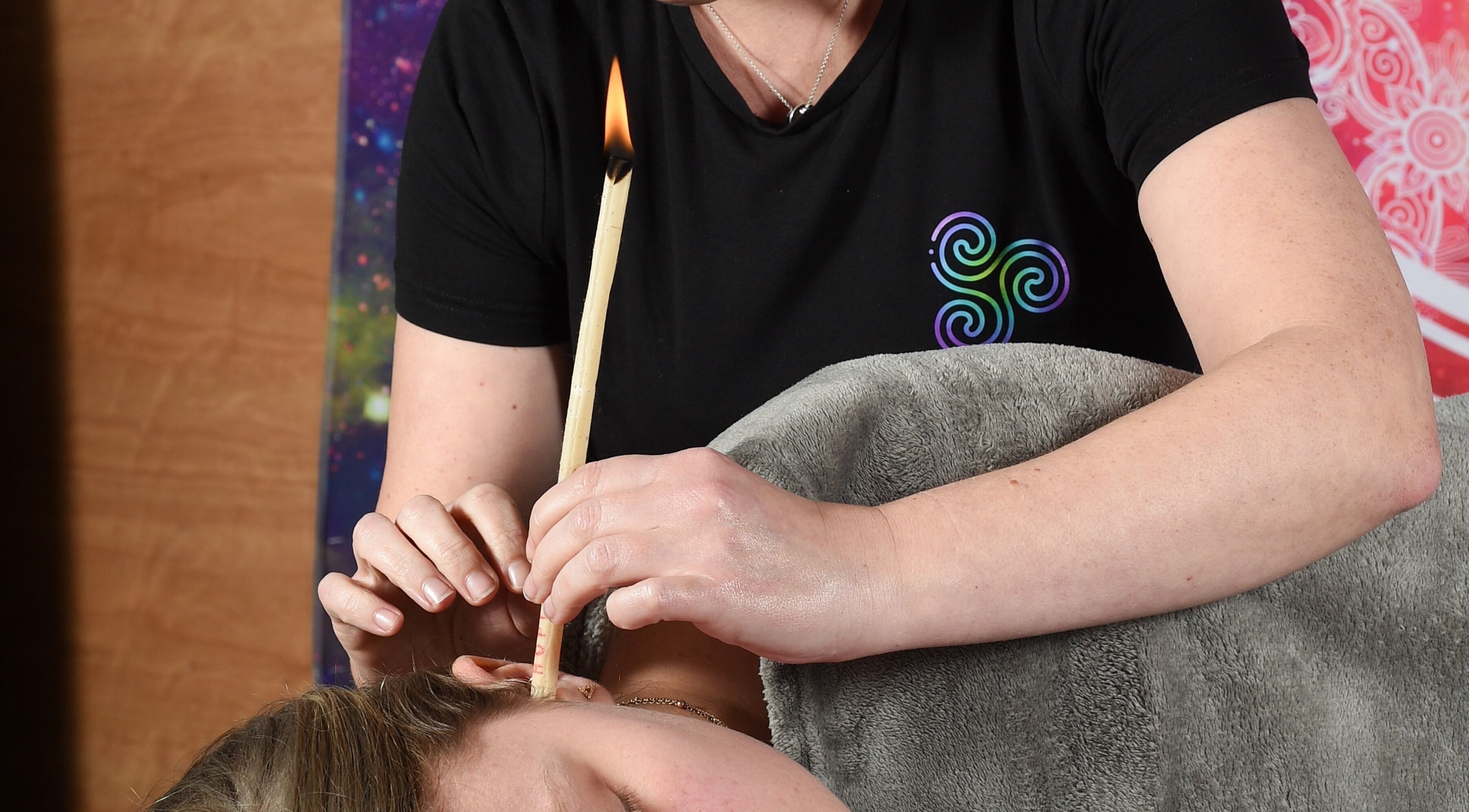 Ear candling at Trinity Wellness, Stokenchurch, England. A calming therapy for relaxation and wellness.