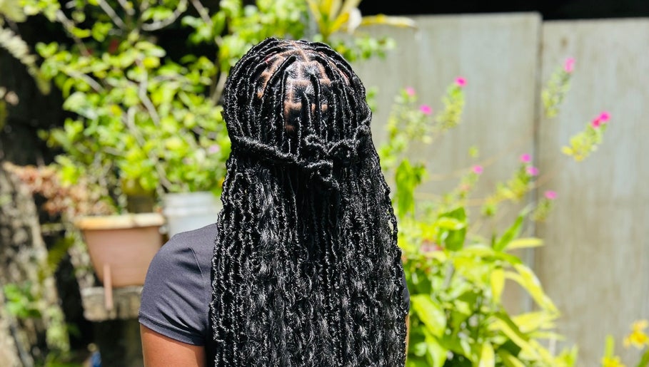 Exquisite braided hairstyle at Kalis Hair Lab in Saint John, Antigua and Barbuda, DM.