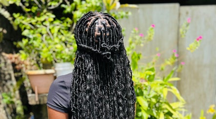 Exquisite braided hairstyle at Kalis Hair Lab in Saint John, Antigua and Barbuda, DM.