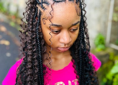 Intricate braided hairstyle at Kalis Hair Lab, Saint John, Antigua and Barbuda, DM, showcasing expert styling.