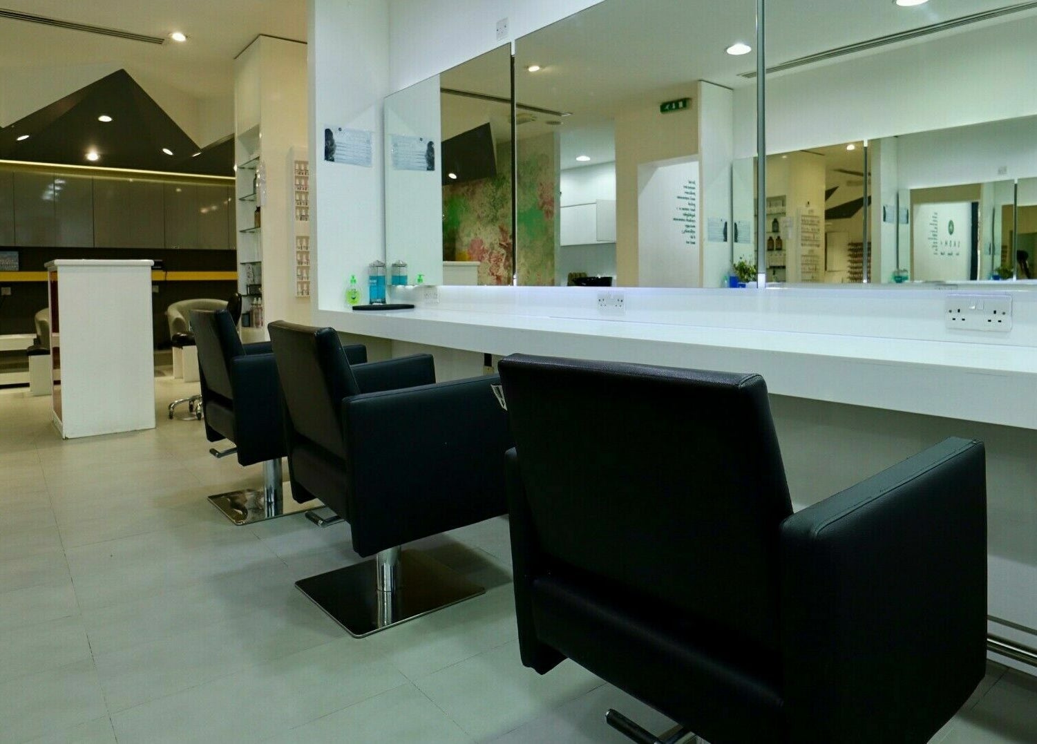 Modern interior of Sasha Beauty Salon Jumeirah Branch - SJB in Dubai, Dubai, AE with sleek styling stations.