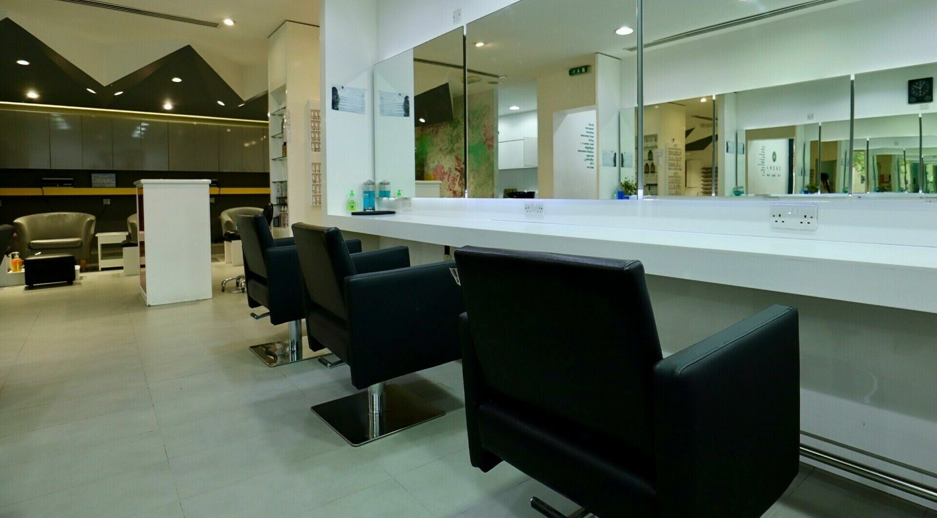 Modern interior of Sasha Beauty Salon Jumeirah Branch - SJB in Dubai, Dubai, AE with sleek styling stations.