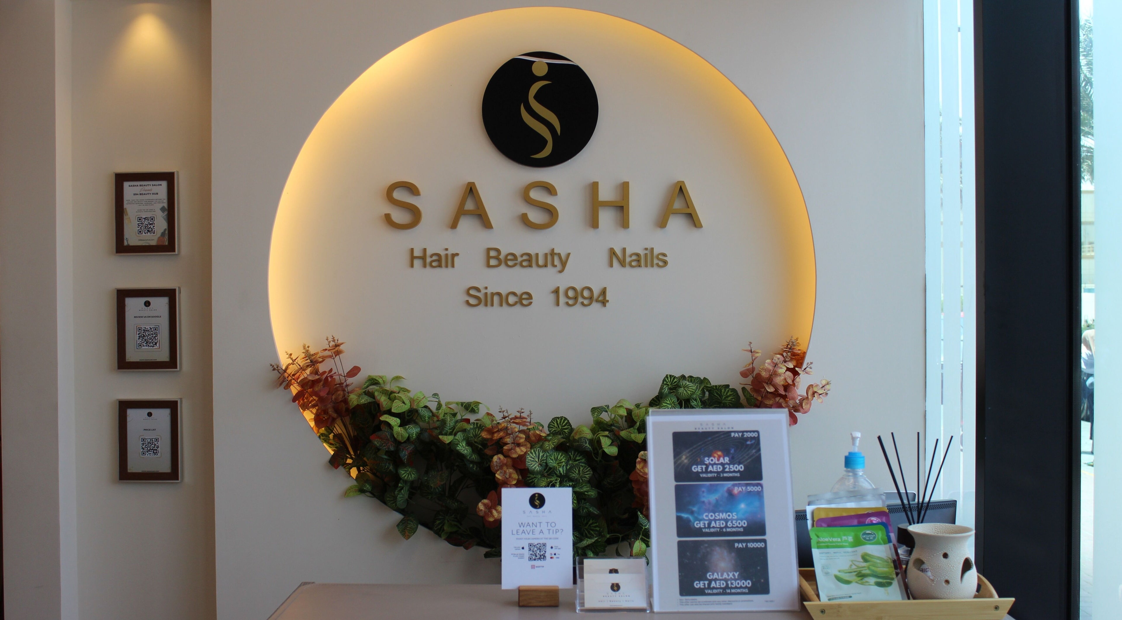 Warm, elegant interior of Sasha Beauty Salon JVC Branch JVC in Dubai, AE, showcasing floral decor and reception.