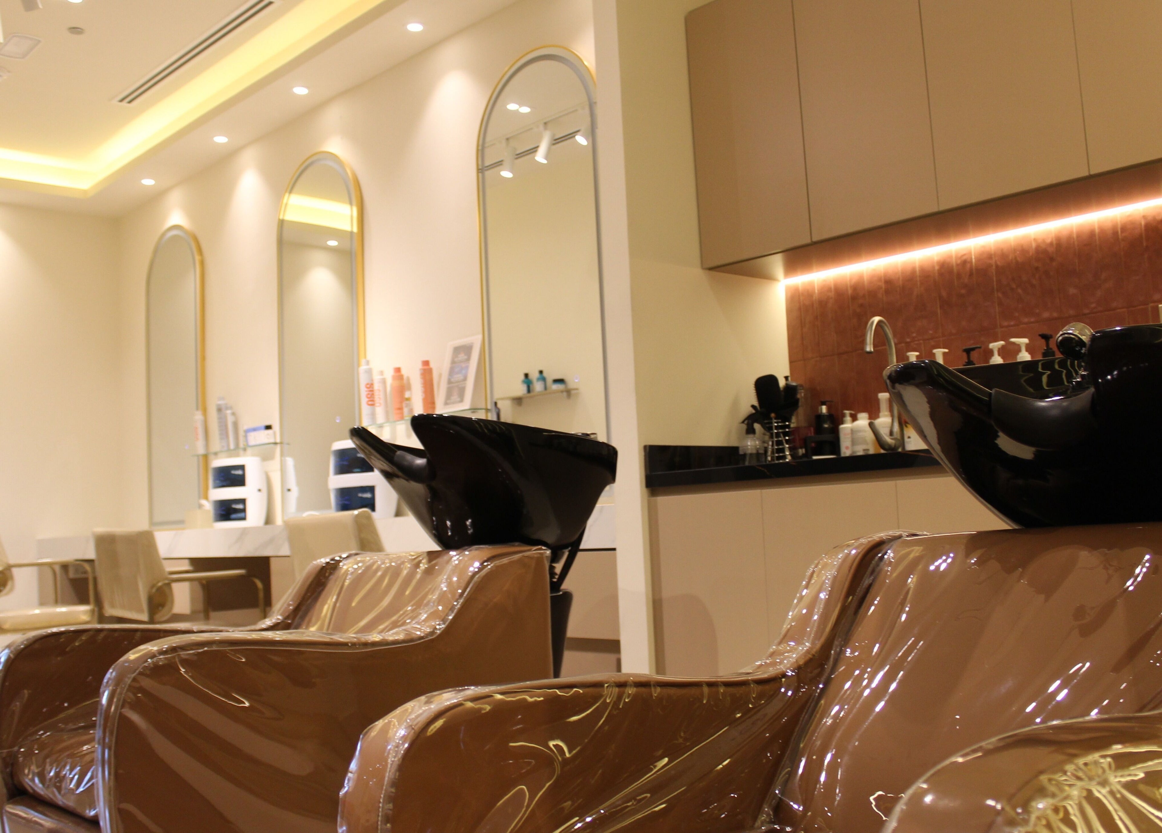 Chic and modern interior of Sasha Beauty Salon JVC Branch JVC, Dubai, AE with stylish seating and decor.