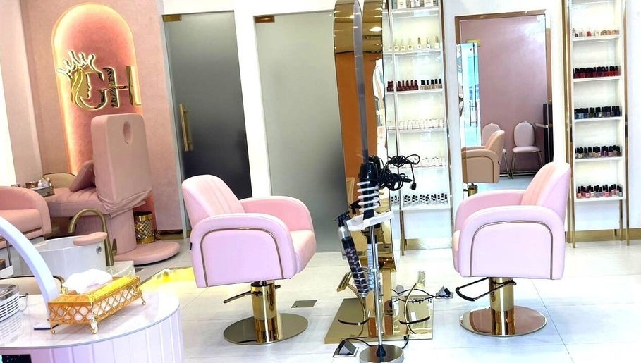 Elegant Glam Hub Beauty Centre chairs in pink and gold, Dubai, AE, offering premium salon services.