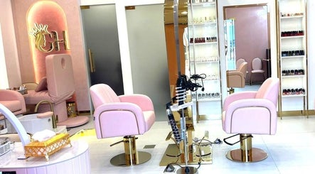 Elegant Glam Hub Beauty Centre chairs in pink and gold, Dubai, AE, offering premium salon services.