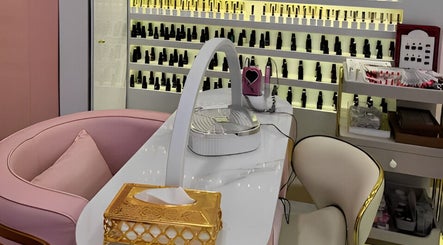 Manicure station at Glam Hub Beauty Centre, Dubai, AE, showcasing elegant decor and nail polish selections.