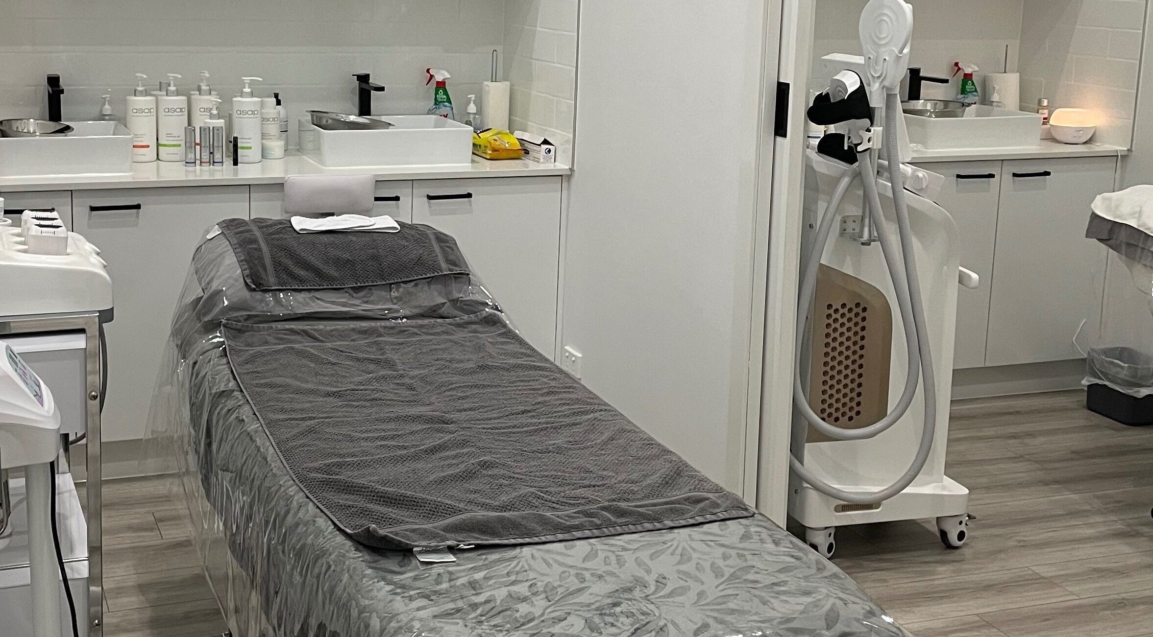 Interior of Emina Skin Therapy in Coolaroo, Victoria, AU featuring a treatment room with modern equipment.