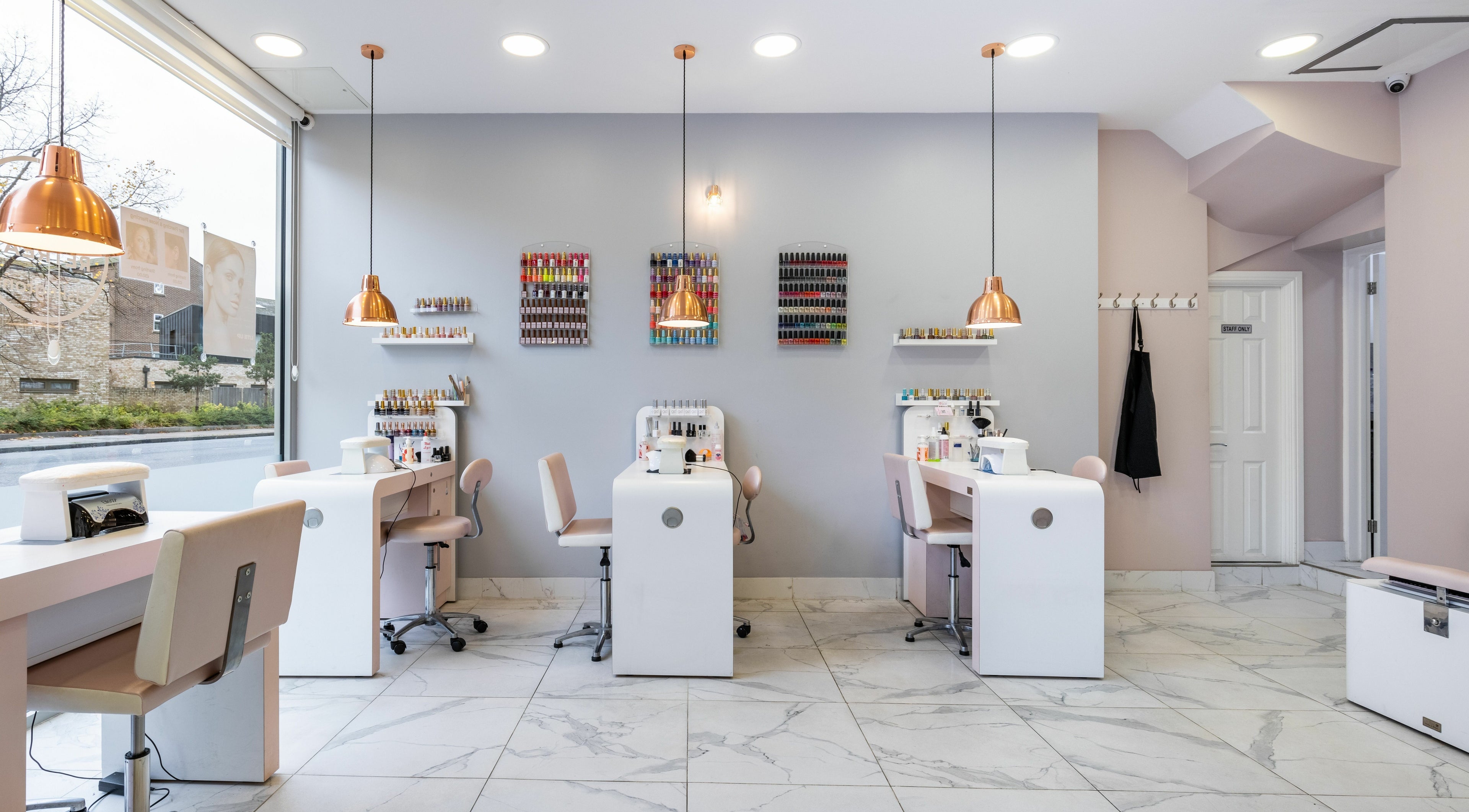Bright, modern nail studio at The Beauty Retreat Islington, London, England, GB with sleek stations and colorful polish.