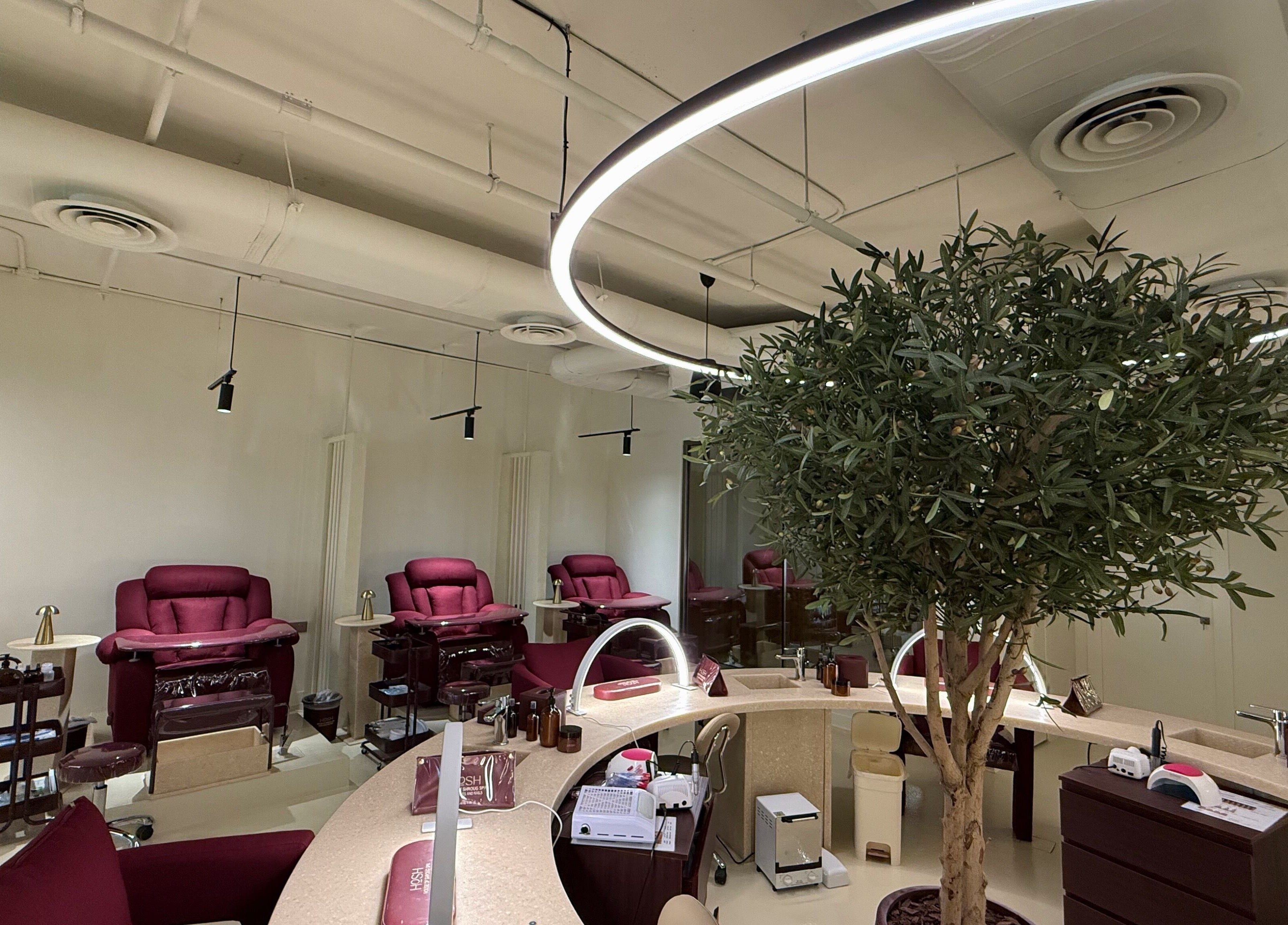 Luxurious pedicure chairs and modern decor at HOSH - House Of Shroug Salon, Riyadh, SA.