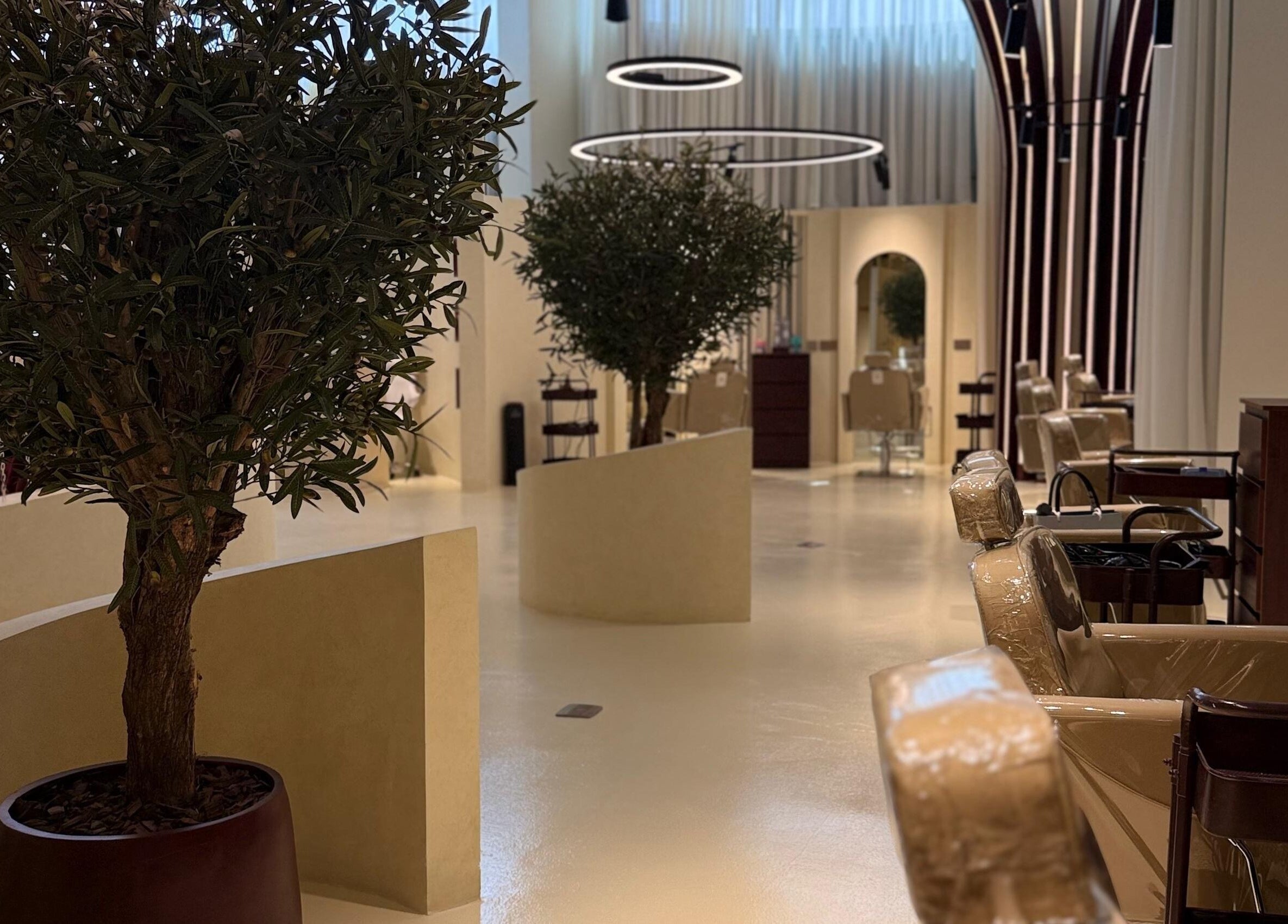 Chic interior of HOSH - House Of Shroug Salon in Riyadh, SA with plush seating and modern decor.