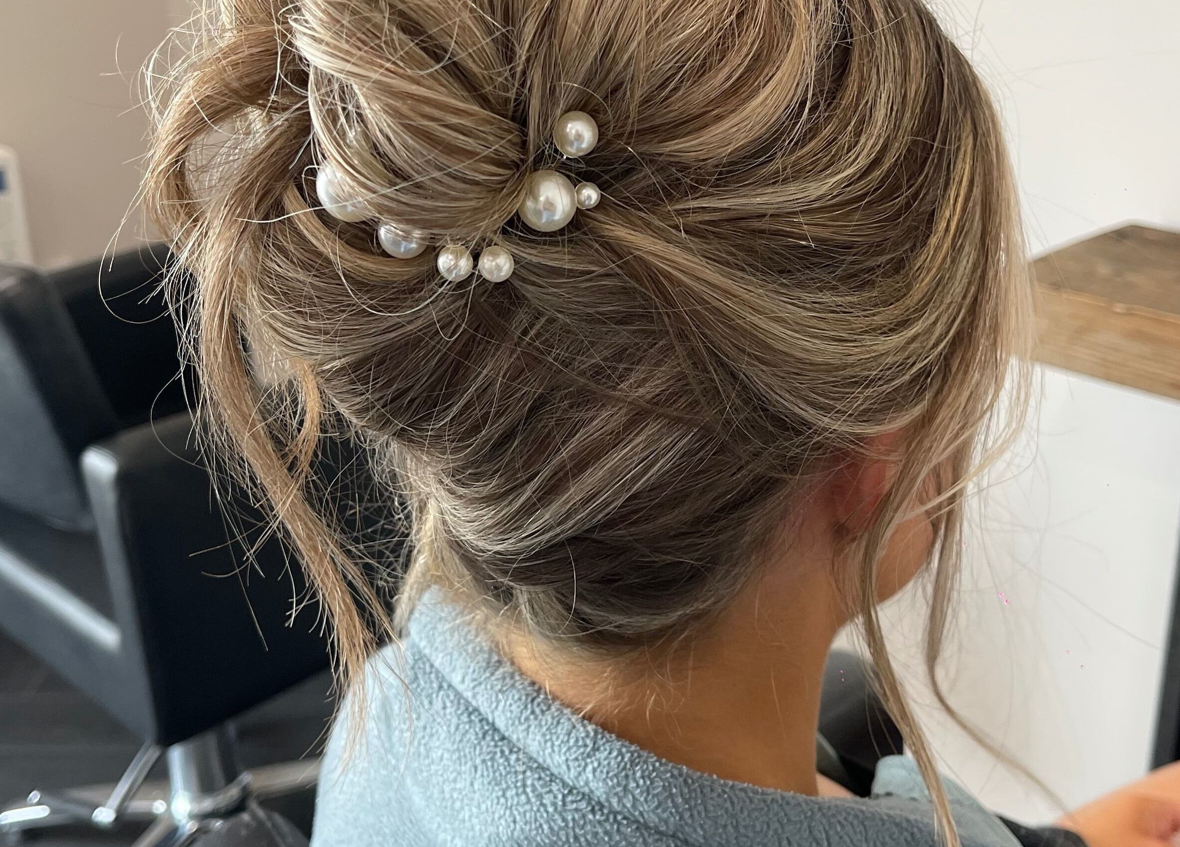 Sophisticated updo hairstyle with pearls at Studio A, County Meath, County Meath, IE.
