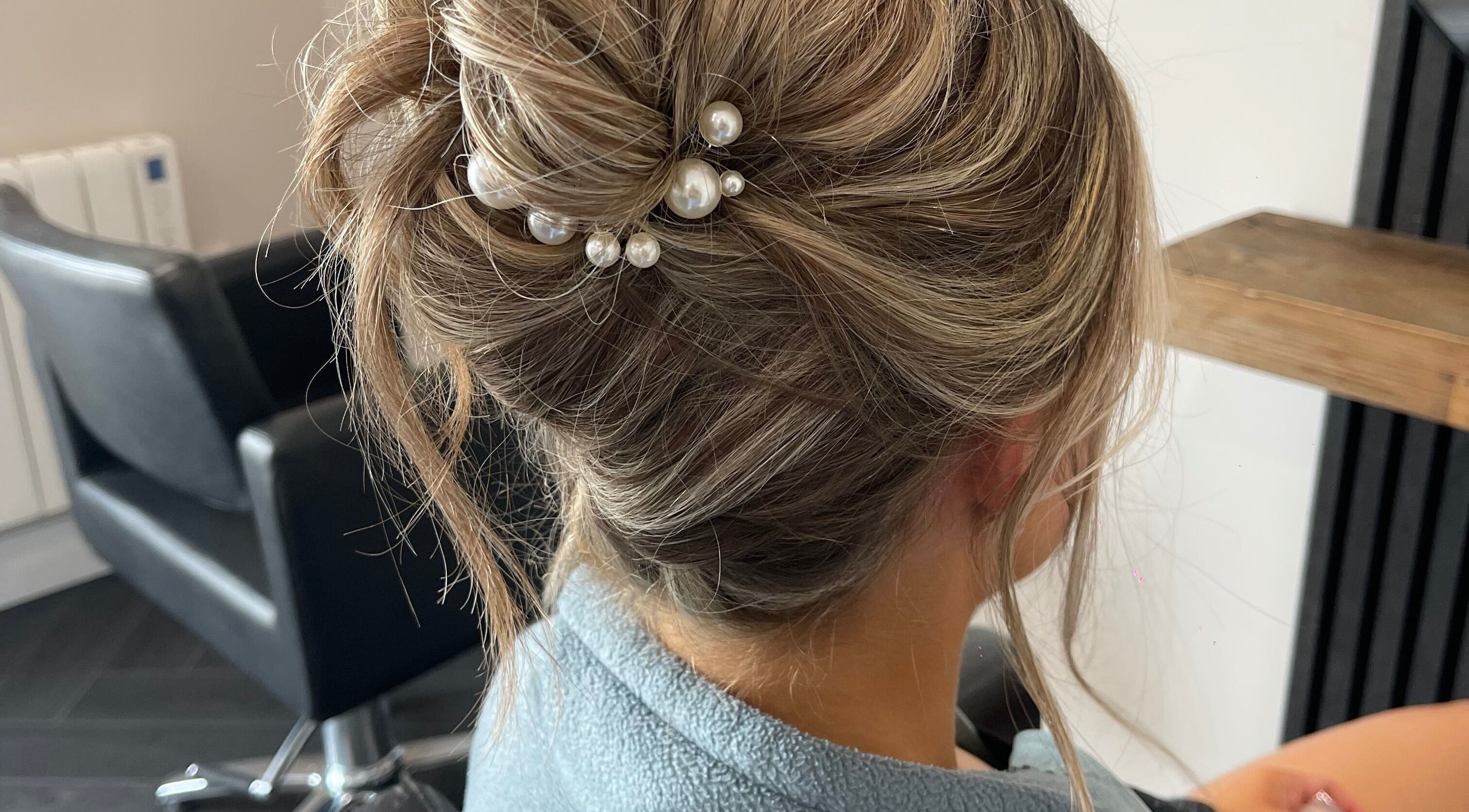 Sophisticated updo hairstyle with pearls at Studio A, County Meath, County Meath, IE.