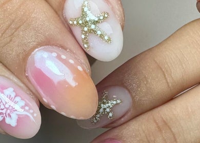 Elegant starfish nail art at Get Frenched, Chesterfield, England, GB showcasing intricate designs and vibrant colors.