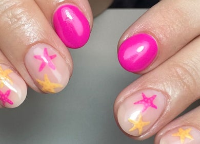 Vibrant pink and starfish nail art at Get Frenched, Chesterfield, England, GB, showcasing stunning nail design.