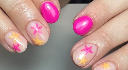 Vibrant pink and starfish nail art at Get Frenched, Chesterfield, England, GB, showcasing stunning nail design.
