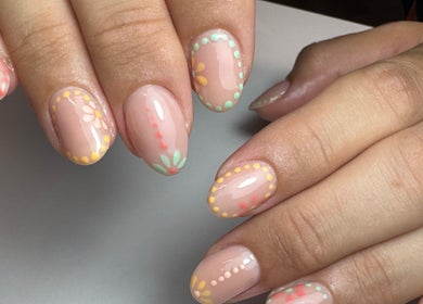 Colorful floral nail art at Get Frenched, Chesterfield, England, GB showcases intricate designs.