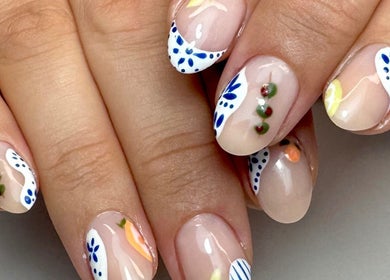 Elegant nail art at Get Frenched, Chesterfield, England, GB showcasing delicate floral designs.