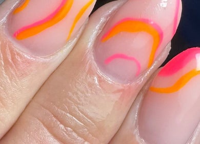Close-up of vibrant nail art with pink and orange swirls at Get Frenched, Chesterfield, England, GB.