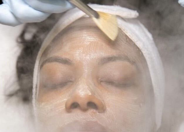 Woman receiving facial treatment at Ustoria Lounge, Port of Spain, Port of Spain Corporation, TT.