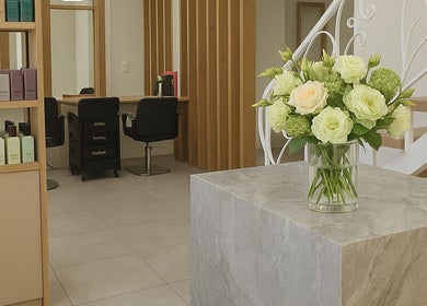 Stylish interior of 4way Beauty salon in Limassol showcasing chic decor and floral display.