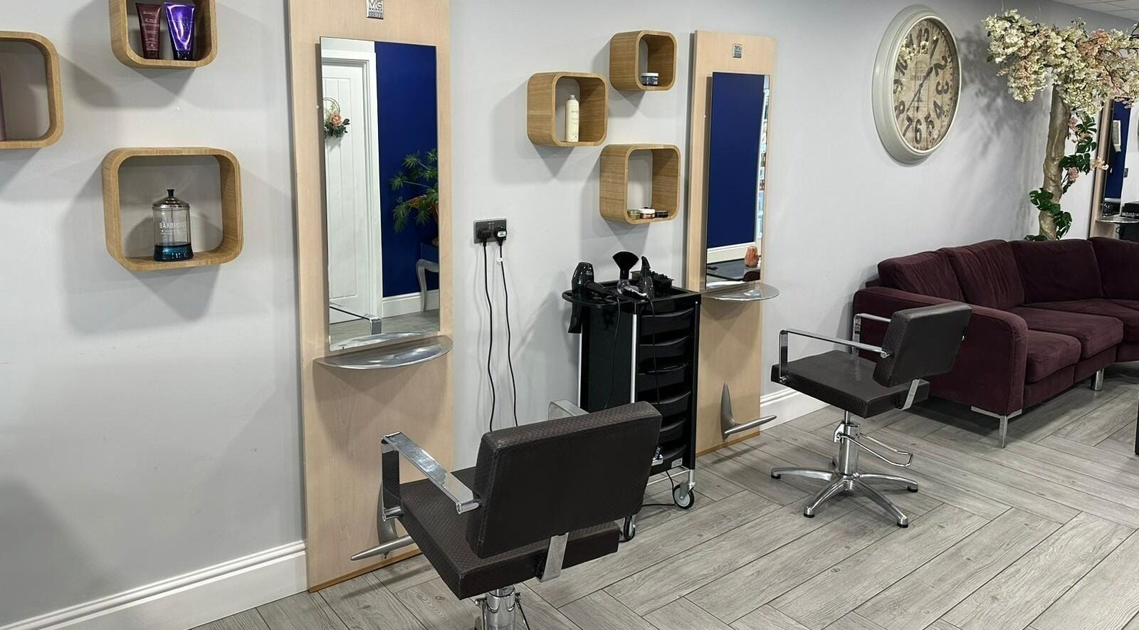 Elegant salon setting at Anthony Linhart The Salon, Ryde, England, GB with modern chairs and wall decor.