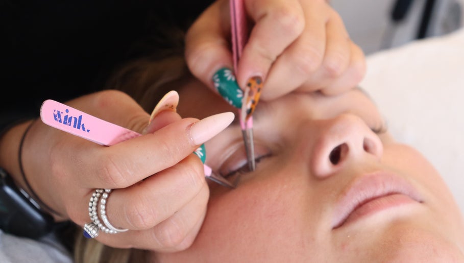Eyelash extension application at LP Extensions, Fordingbridge, England, GB. Close-up of precise beauty service.