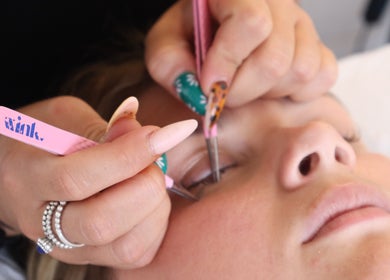 Eyelash extension application at LP Extensions, Fordingbridge, England, GB. Close-up of precise beauty service.