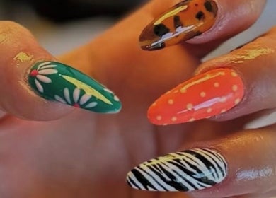 Colorful nail art with floral, polka dots, and animal prints at LP Extensions, Fordingbridge, England, GB.