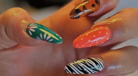 Colorful nail art with floral, polka dots, and animal prints at LP Extensions, Fordingbridge, England, GB.