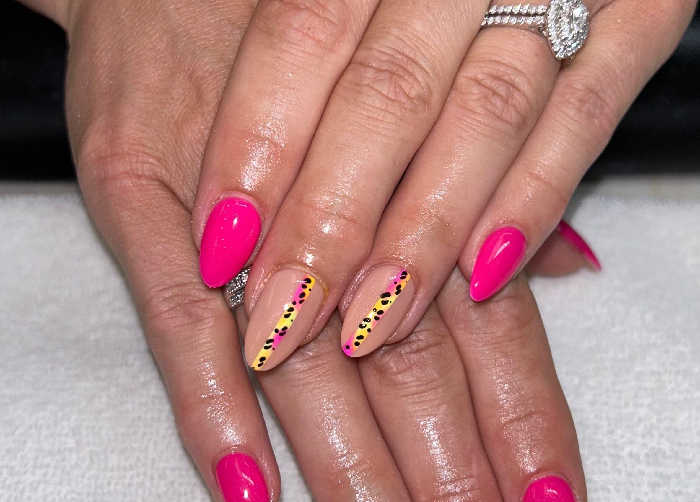 Bright pink nail art at The Lacquer Bar, Chatham, Ontario, CA showcasing intricate design flair.