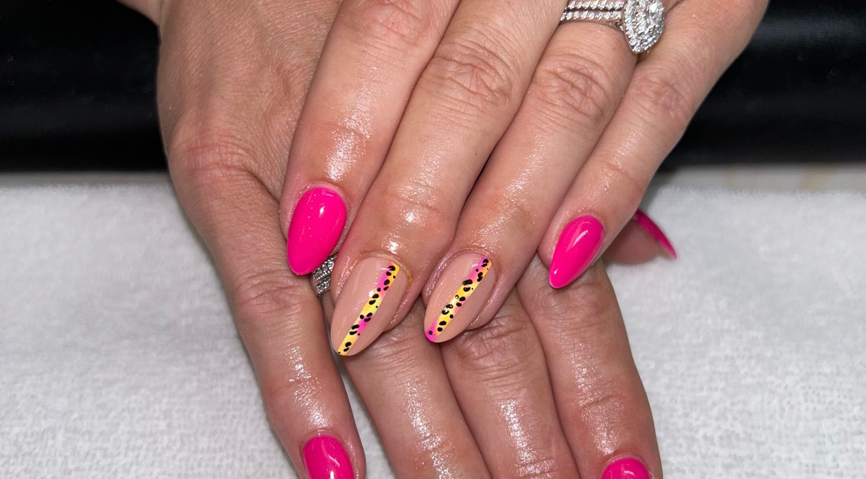 Bright pink nail art at The Lacquer Bar, Chatham, Ontario, CA showcasing intricate design flair.