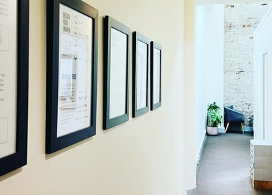 Framed lash art on the hallway wall of Holylashes North Melbourne, a beauty venue in Melbourne, Victoria, AU.