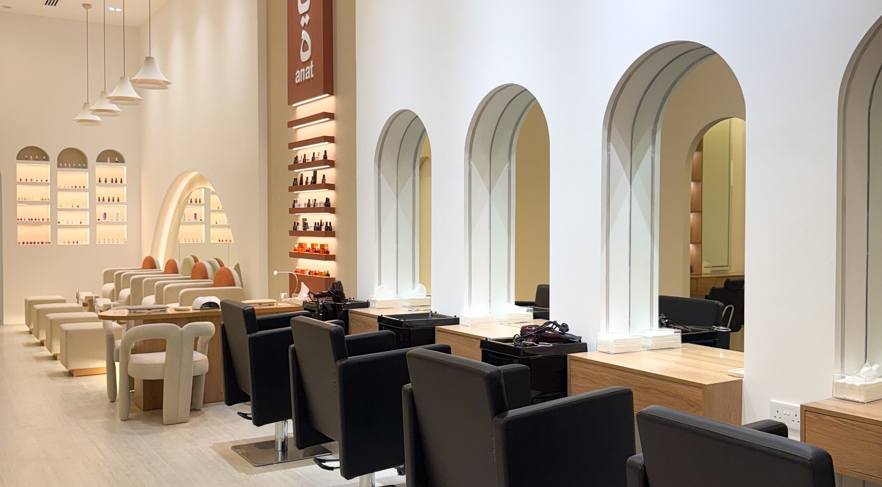 Elegant interior of Anat Beauty Spa & Salon - RAK in Ras Al Khaimah, AE with stylish seating and product displays.