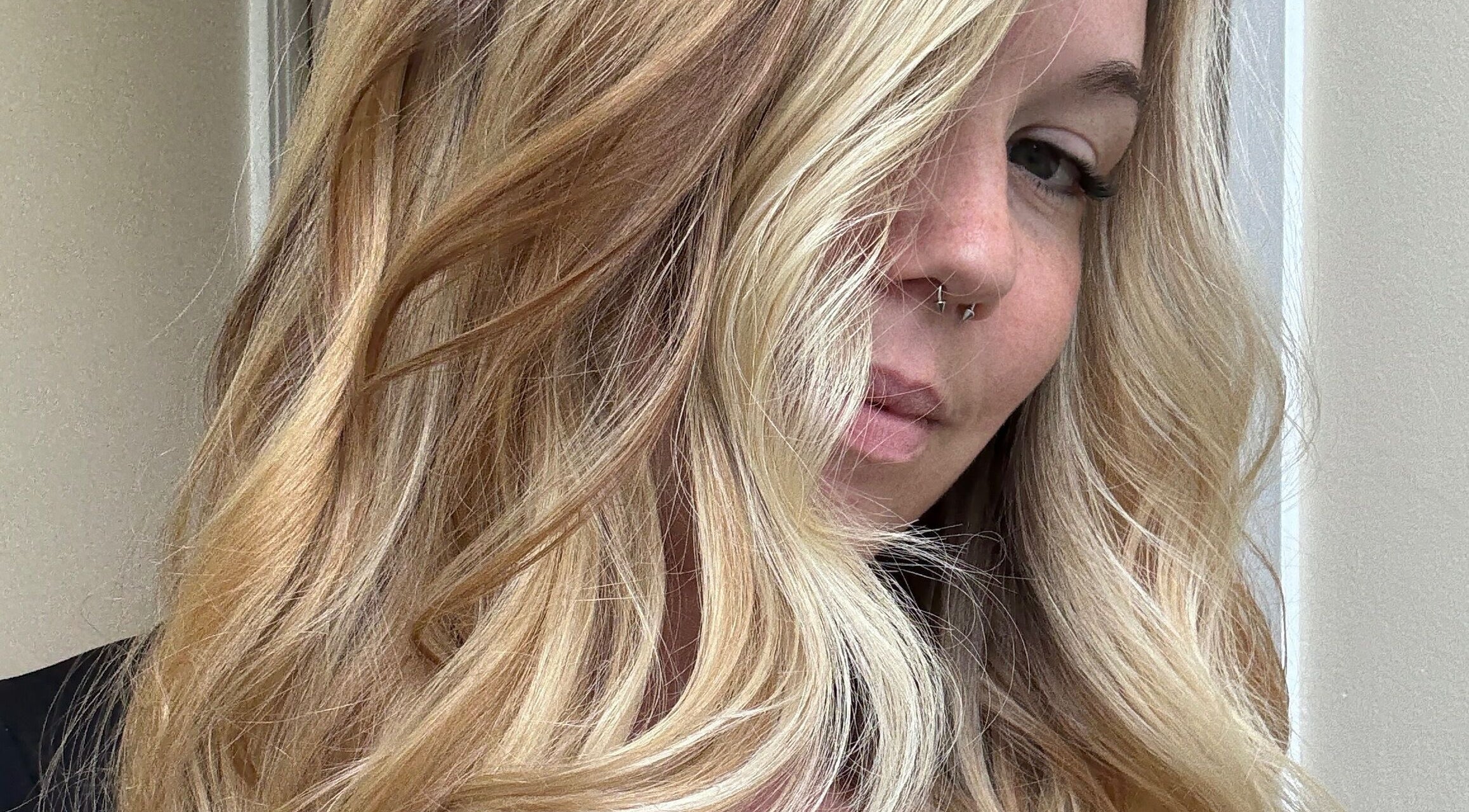 Close-up of wavy blonde hair styled at LoX Salon, Winchester, Virginia, US.