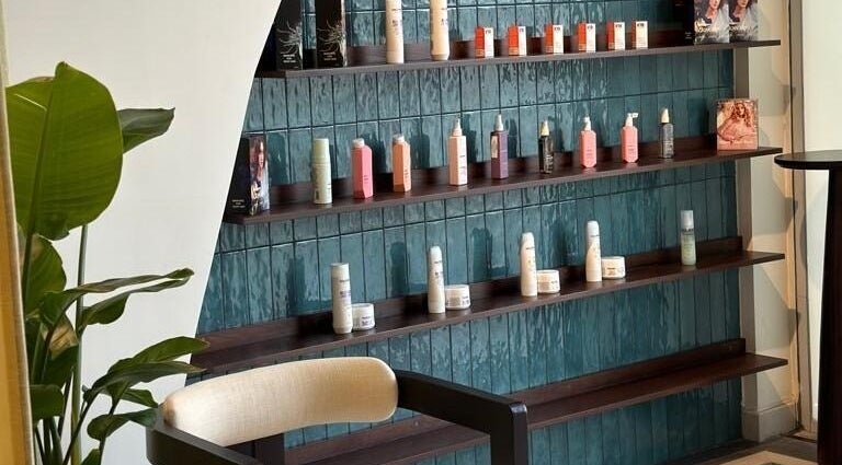 Fablow's Hair and Nail Salon, Riyadh, elegant product display with vibrant shelves and plant decor.