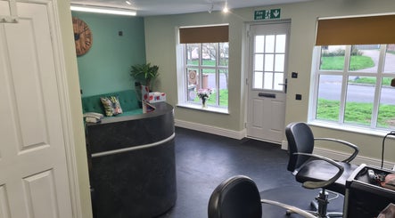 Reception area at The Green Lounge, Haughley, England, GB, featuring stylish decor and natural light.
