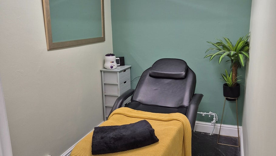 The Green Lounge spa room with plush chair in Haughley, England, GB for ultimate relaxation.