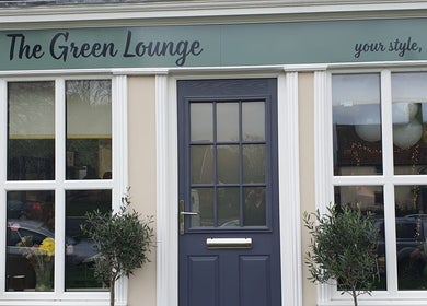 Front view of The Green Lounge in Haughley, England, GB with stylish windows and greenery.