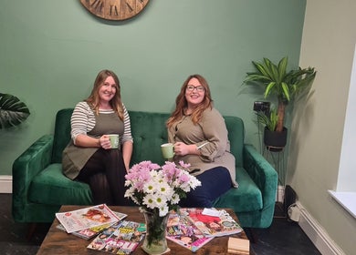 Cozy seating area at The Green Lounge, Haughley, England, GB with guests enjoying a relaxing ambiance.