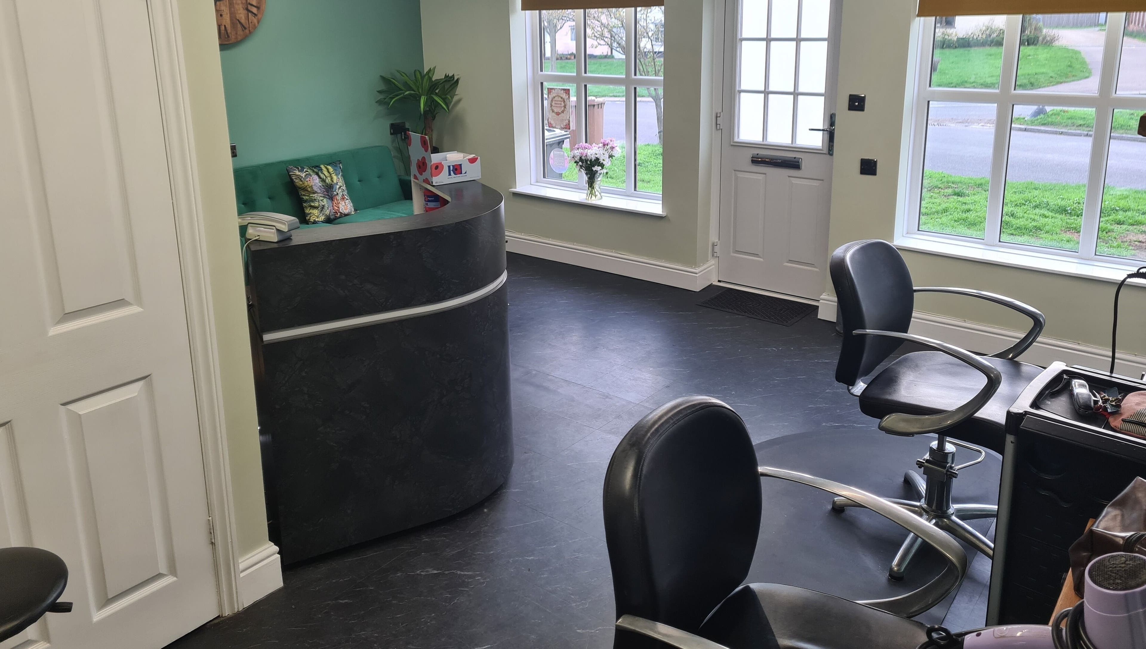The Green Lounge reception area with modern decor in Haughley, England, GB, welcoming clients.