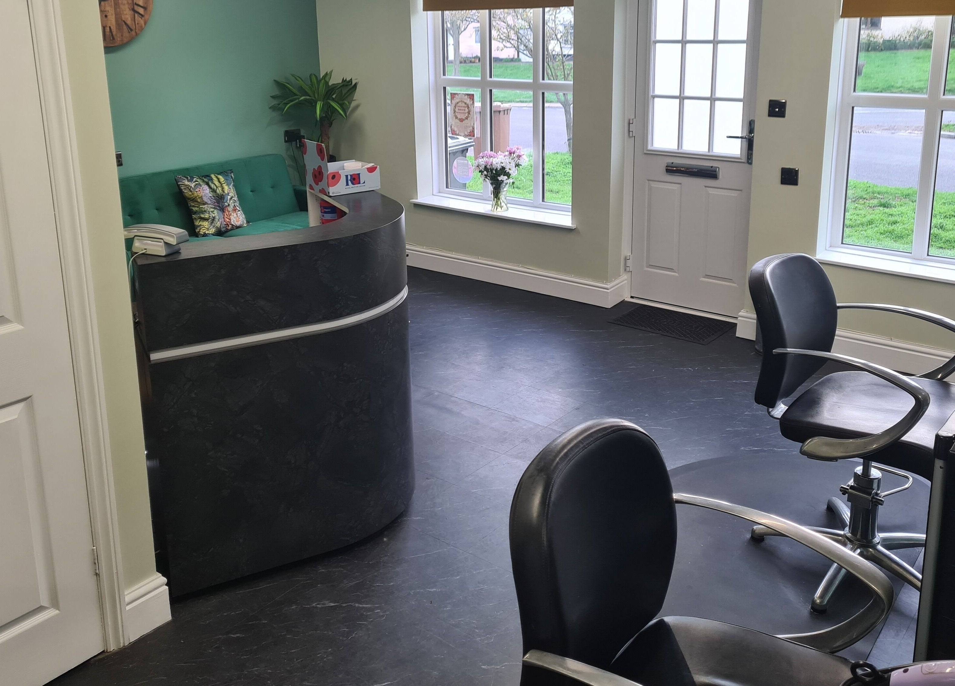 The Green Lounge reception area with modern decor in Haughley, England, GB, welcoming clients.