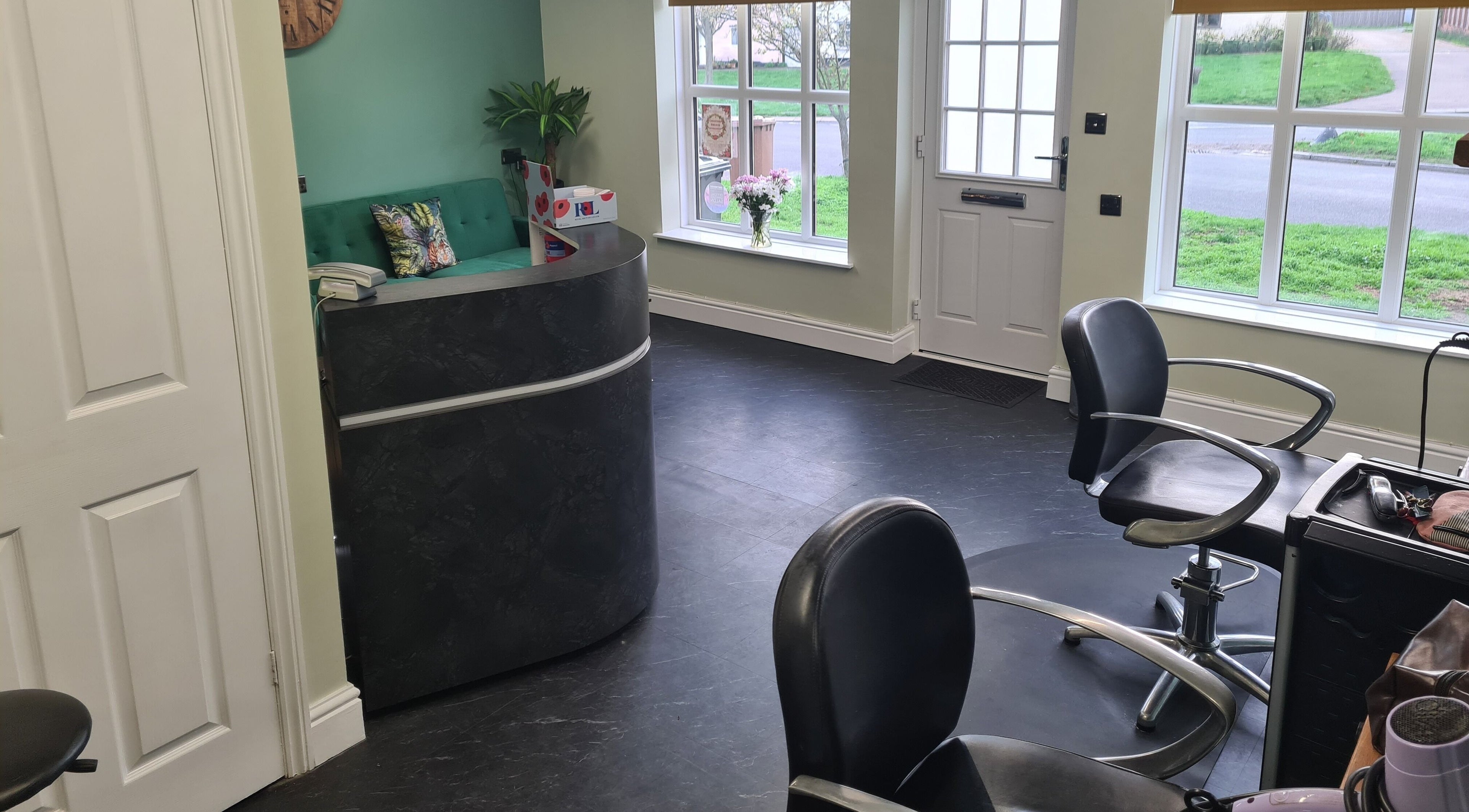 The Green Lounge reception area with modern decor in Haughley, England, GB, welcoming clients.