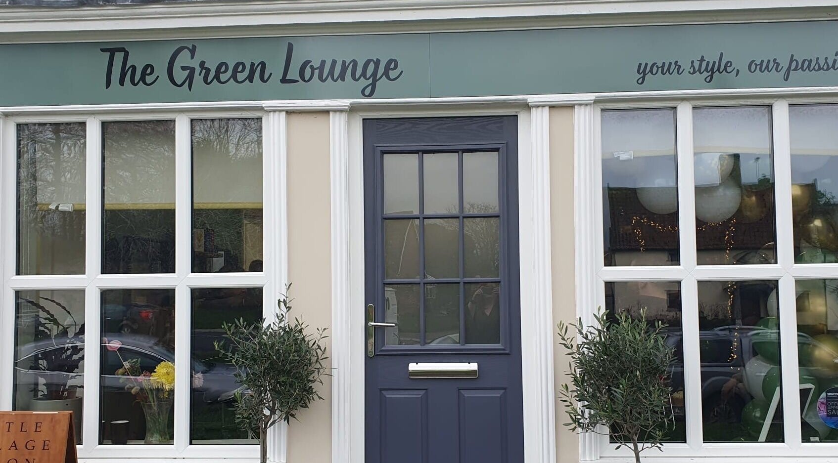 Entrance of The Green Lounge in Haughley, England, GB showcasing elegant exterior with large windows.