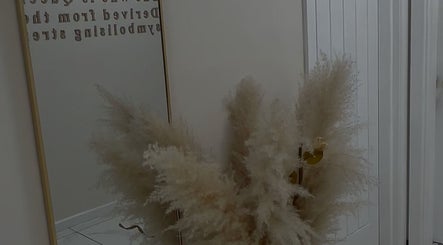 Elegant pampas grass in a mirrored corner at Body Secrets - West London, London, England, GB.