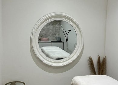 Tranquil treatment room at Body Secrets - West London, showcasing a massage table in London, England, GB.